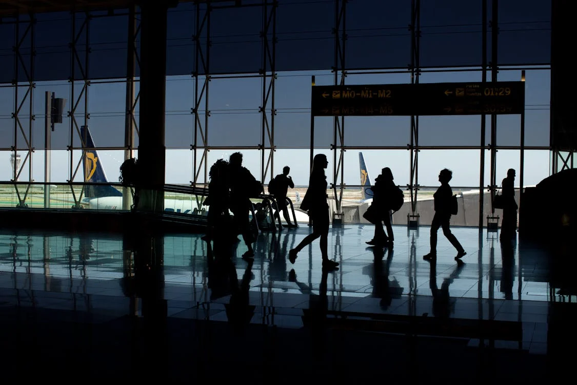 A family boarding a plane with their passports in hand, excited for their international move.