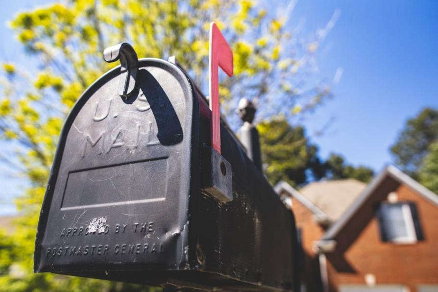 A selective focus photo of a mailbox, symbolizing the process of submitting documents for passport applications.